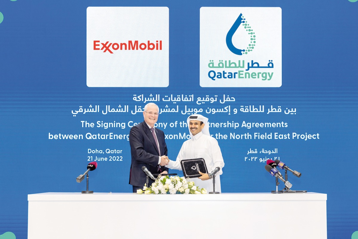 Minister of State for Energy Affairs, the President and CEO of QatarEnergy H E Saad Sherida Al Kaabi and Chairman and CEO of ExxonMobil Darren Woods during the agreement signing in the presence of senior executives from both sides, yesterday.
