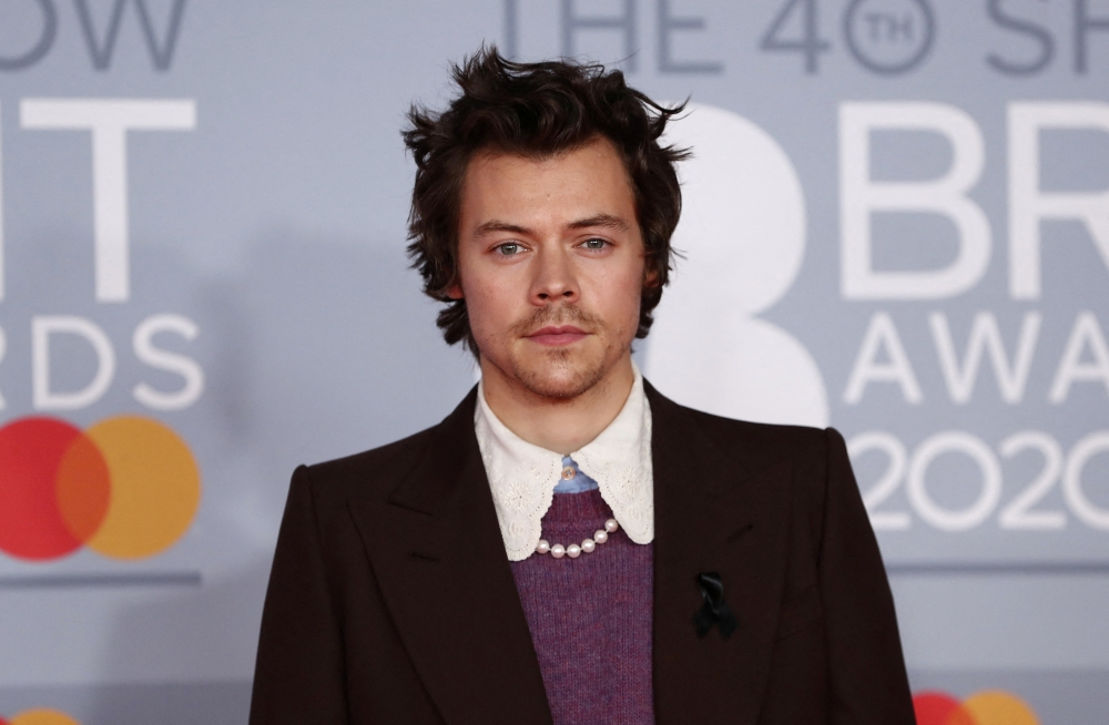 Harry Styles poses as he arrives for the Brit Awards at the O2 Arena in London, Britain, February 18, 2020 REUTERS/Simon Dawson/File Photo