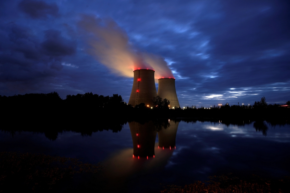 FILE PHOTO: Steam rises from cooling towers of the Electricite de France (EDF) nuclear power plant in Belleville-sur-Loire, France October 12, 2021. REUTERS/Benoit Tessier/File Photo