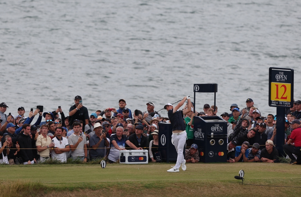 Norway's Viktor Hovland hits his tee shot on the 12th during the third round. (REUTERS/Russell Cheyne)