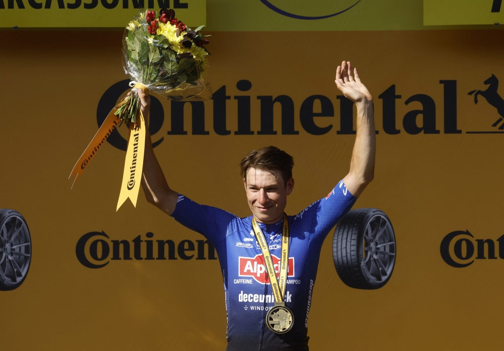 Belgian Jasper Philipsen celebrates on the podium after winning Tour de France stage 15, in France, on July 17, 2022. (REUTERS/Gonzalo Fuentes)