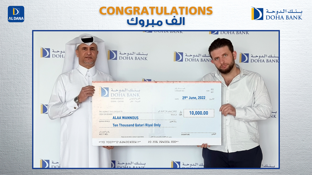 Doha Bank official awarding the winner of Al Dana draw.