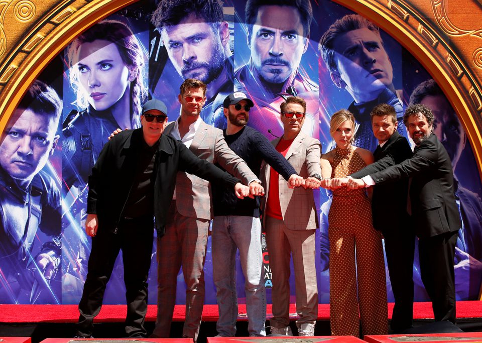 Actors Robert Downey Jr., Chris Evans, Mark Ruffalo, Chris Hemsworth, Scarlett Johansson, Jeremy Renner and Marvel Studios President Kevin Feige pose for a photo during the handprint ceremony at the TCL Chinese Theatre in Hollywood, Los Angeles, California, U.S. April 23, 2019. REUTERS/Mario Anzuoni

