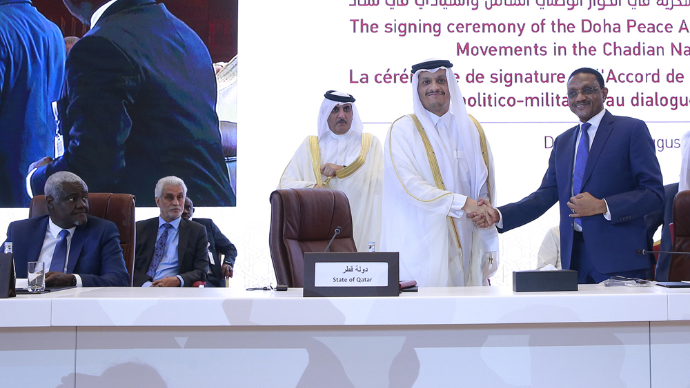 Deputy Prime Minister and Minister of Foreign Affairs H E Sheikh Mohammed bin Abdulrahman Al Thani; Chad's Minister of Foreign Affairs H E Mahamat Zene Cherif; and Chairperson of African Union Commission Moussa Faki (first left) at the peace agreement signing ceremony. PICS: Rajan Vadakkemuriyil