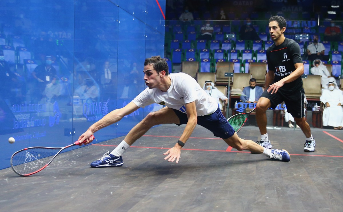 Egypt’s Ali Farag (left) in action against compatriot Tarek Momen during the 2021 QTerminals Qatar Classic.