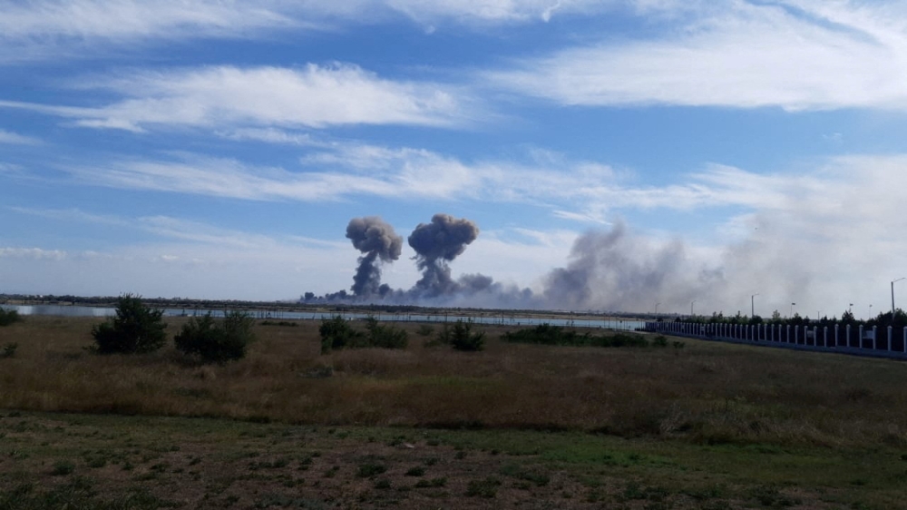 File photo: Smoke rises after explosions were heard from the direction of a Russian military airbase near Novofedorivka, Crimea, in this still image obtained by Reuters August 9, 2022. 