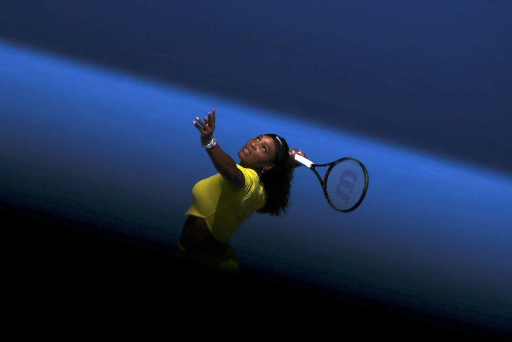 Serena Williams of the U.S. serves during her first round match against Italy's Camila Giorgi at the Australian Open tennis tournament at Melbourne Park, Australia, January 18, 2016. REUTERS/Jason O'Brien/File Photo