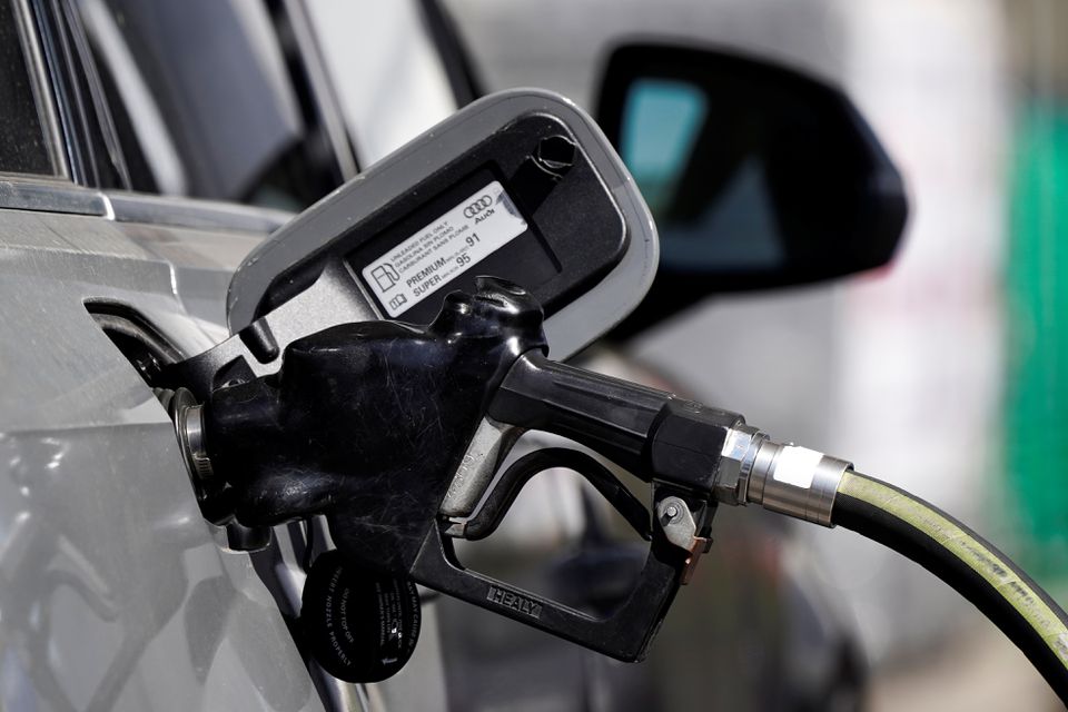 A gas pump is inserted inside an Audi vehicle at a Mobil gas station in Beverly Boulevard in West Hollywood, California, U.S., March 10, 2022. Picture taken March 10, 2022. REUTERS/Bing Guan

