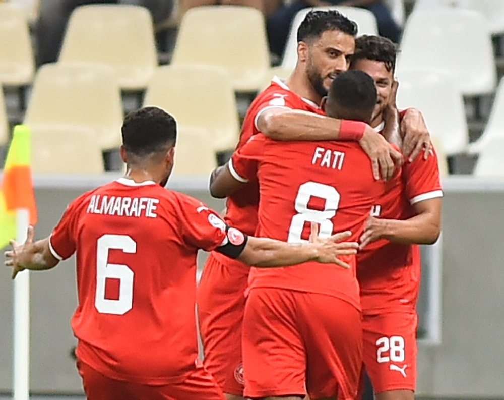 Mehrdad Mohammadi celebrates with team-mates.