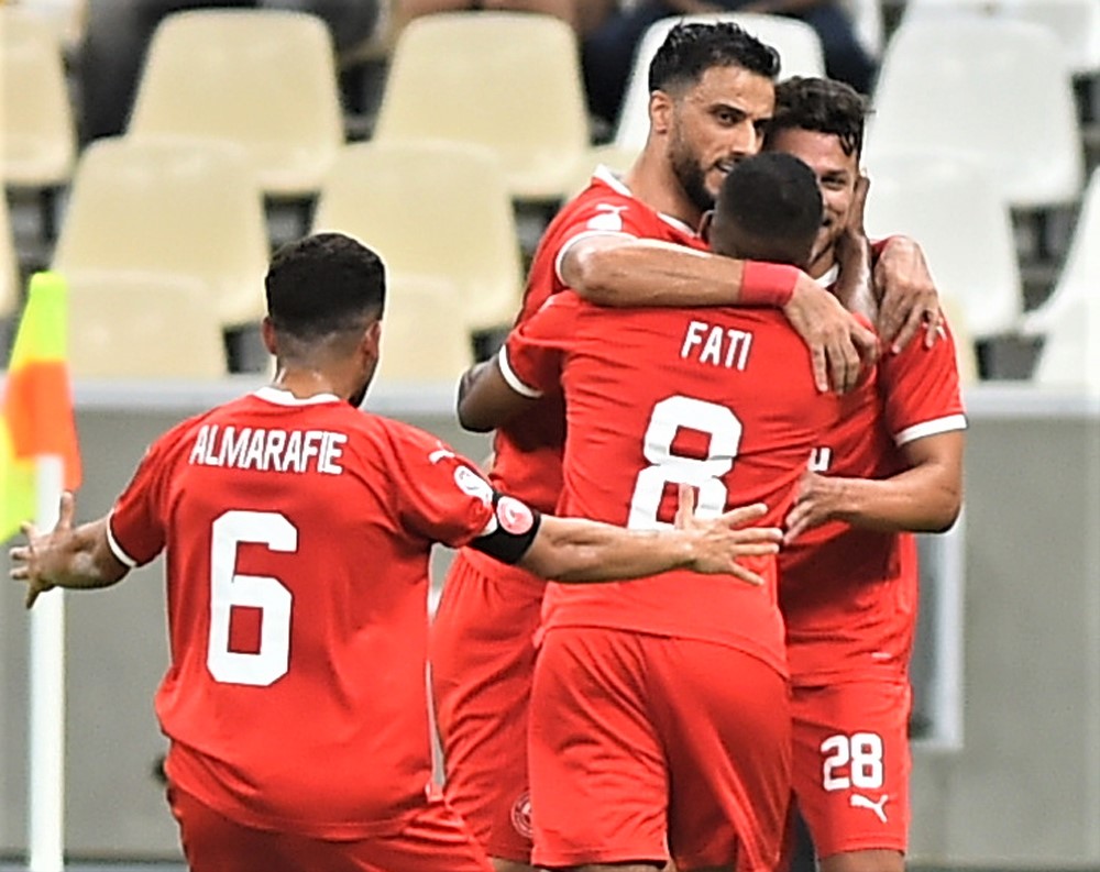 Mehrdad Mohammadi celebrates with team-mates. Picture: Abdul Basit / The Peninsula