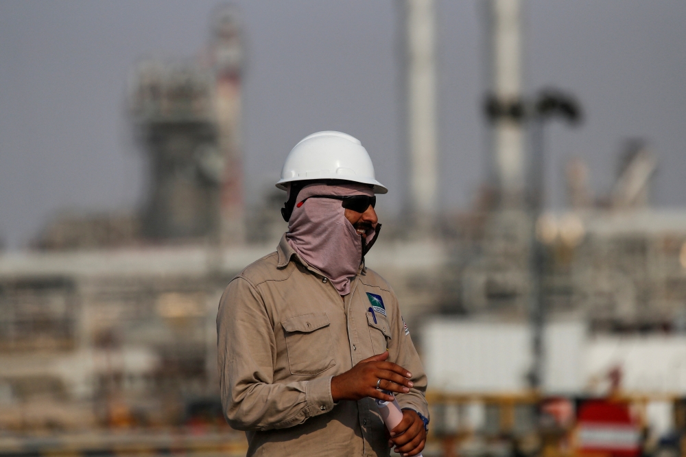 An employee looks on at Saudi Aramco oil facility in Abqaiq, Saudi Arabia October 12, 2019. Reuters/Maxim Shemetov/File Photo