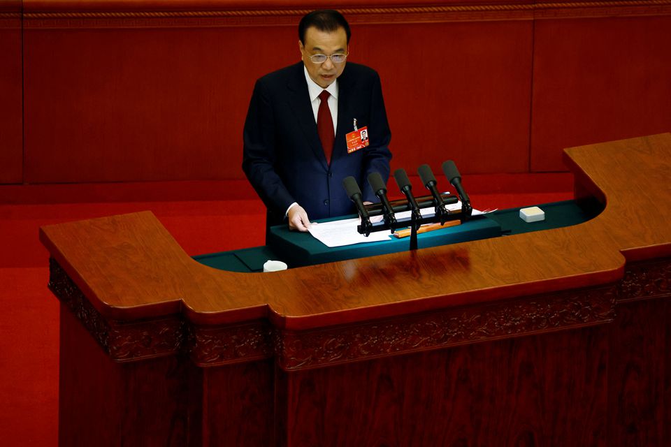 Chinese Premier Li Keqiang speaks at the opening session of the National People's Congress (NPC) at the Great Hall of the People in Beijing, China March 5, 2022. REUTERS/Carlos Garcia Rawlins

