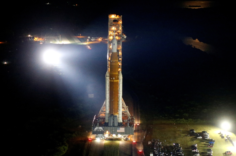 NASA's next-generation moon rocket, the Space Launch System (SLS) Artemis 1 rocket with its Orion crew capsule rolls to launch pad 39B at the Kennedy Space Center in Cape Canaveral, Florida, US, August 16, 2022. (REUTERS/Joe Skipper)