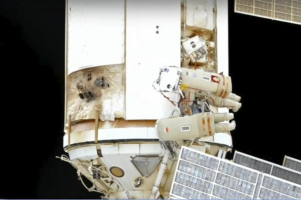 A photo taken from video footage released by Roscosmos Space Agency shows cosmonauts Oleg Artemyev and Denis Matveev during their spacewalk on the International Space Station (ISS) on August 17, 2022.