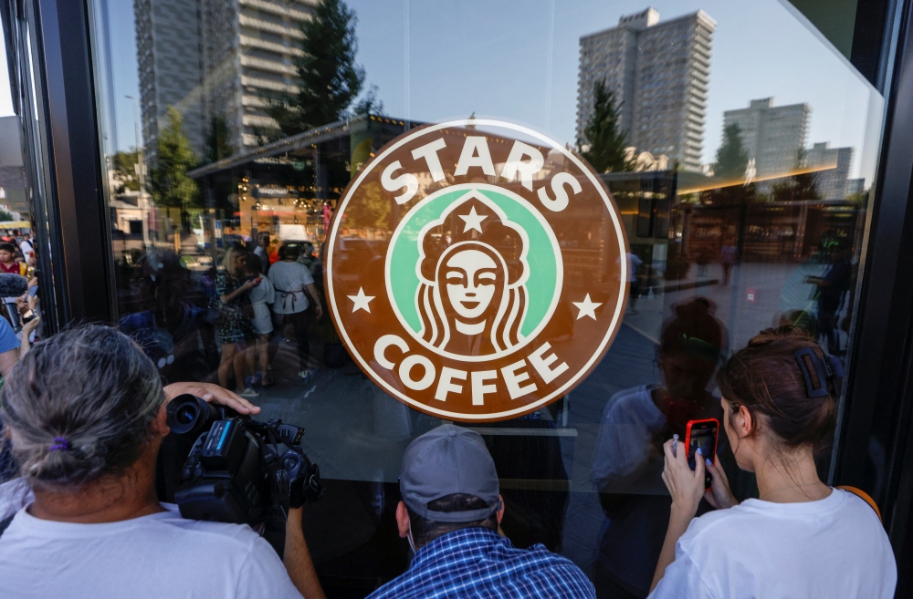 People gather for the launching of the new coffee shop 