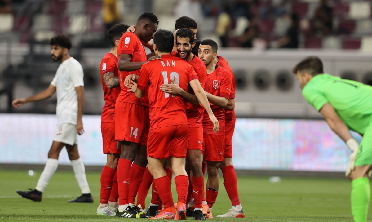 Al Duhail players celebrate after Nam Tae-hee's goal. 