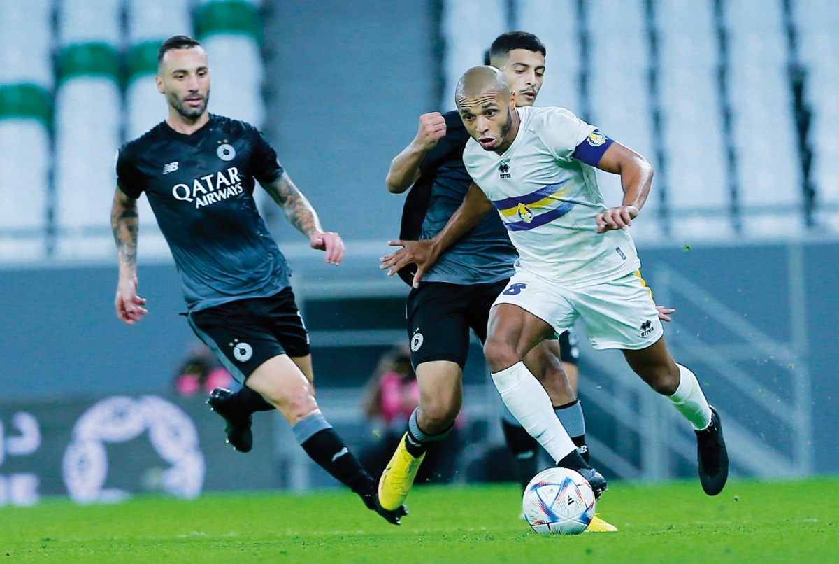 Al Gharafa's Yacine Brahimi (right) in action during match against Al Sadd. PIC: Rajan Vadakkemuriyil