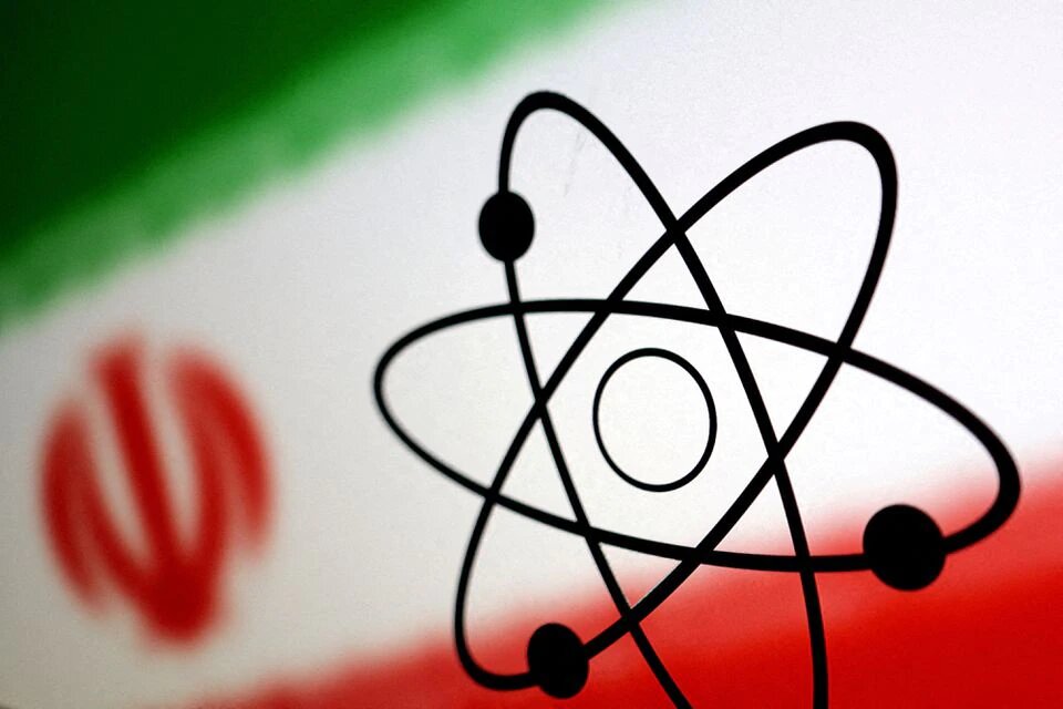 The atomic symbol and the Iranian flag are seen in this illustration, July 21, 2022. REUTERS/Dado Ruvic/Illustration/File Photo


