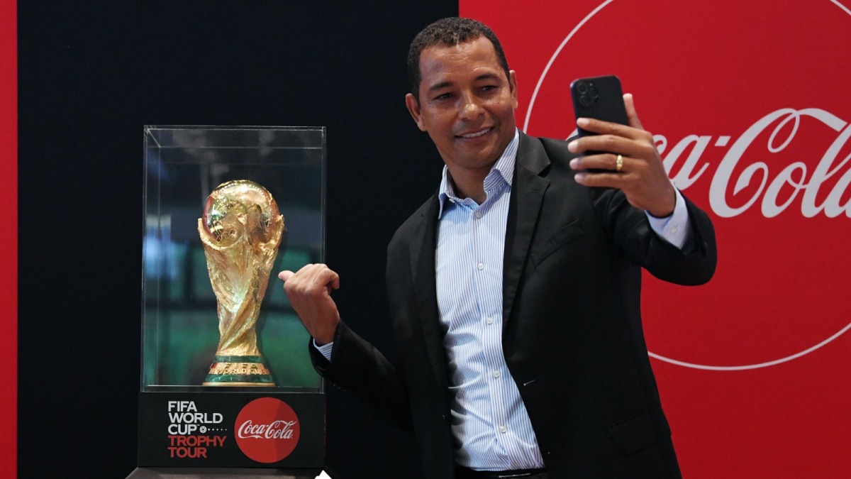 Former Arsenal player and 2002 FIFA World Cup™ winner Gilberto Silva with the FIFA World Cup trophy.