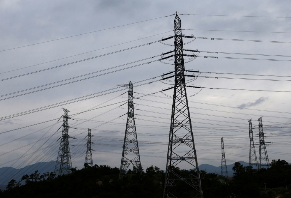 Power transmission towers are seen near the plant of new Shin Kori No. 3 reactor and No. 4 reactor of state-run utility Korea Electric Power Corp (KEPCO) in Ulsan, about 410 km (255 miles) southeast of Seoul, on September 3, 2013. File Photo / Reuters
