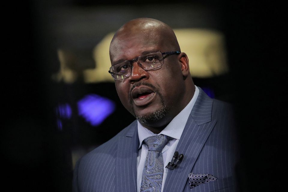 Former basketball star Shaquille O'Neal, speaks during an interview on CNBC about joining the board of Papa John’s International Inc., on the floor of the New York Stock Exchange (NYSE) in New York, U.S., March 22, 2019. REUTERS/Brendan McDermid/File Photo

