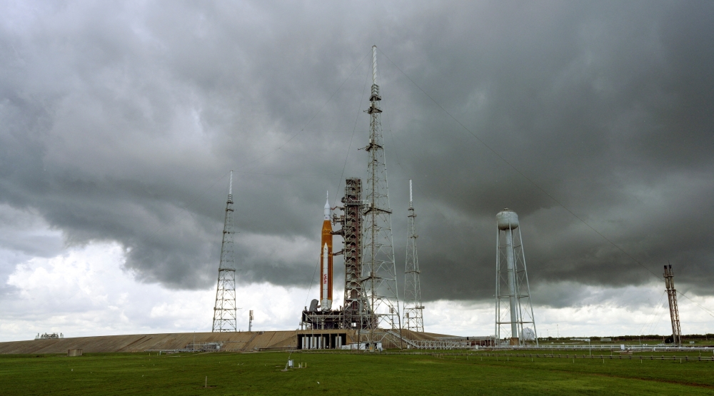 Storm clouds gather over NASA's next-generation moon rocket, the Space Launch System (SLS) rocket with its Orion crew capsule, at Cape Canaveral, Florida, U.S. August 26, 2022. Reuters /Steve Nesius