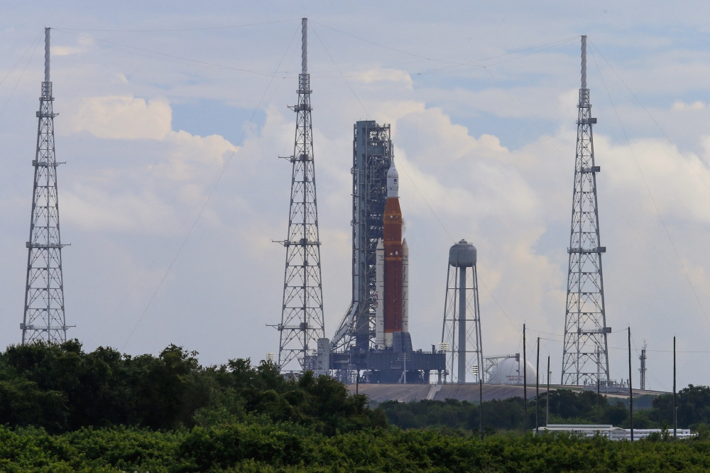 NASA's next-generation moon rocket, the Space Launch System (SLS) , with its Orion crew capsule on top, sits on the pad after the launch of the Artemis I mission was scrubbed, at Cape Canaveral, Florida, US, on August 29, 2022. REUTERS/Joe Skipper