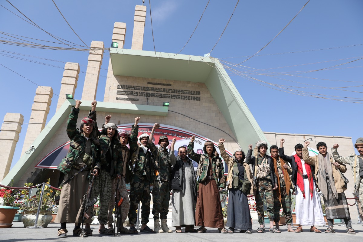 Armed members of the Houthi movement shout slogans as they visit the grave of Houthi senior official Saleh al-Sammad at al-Sabeen Square in Sanaa, Yemen, on January 11, 2021. File 
 Photo / REUTERS