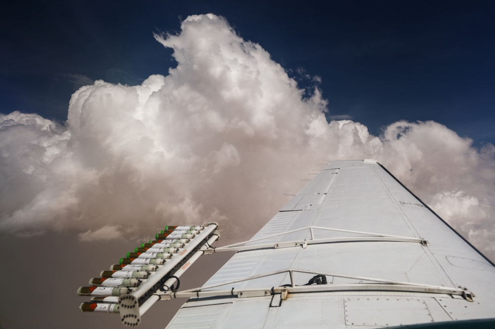 Hygroscopic flares are attached to an aircraft during a cloud seeding flight operated by the National Center of Meteorology, between Al Ain and Al Hayer, in United Arab Emirates, August 24, 2022. Reuters/Amr Alfiky