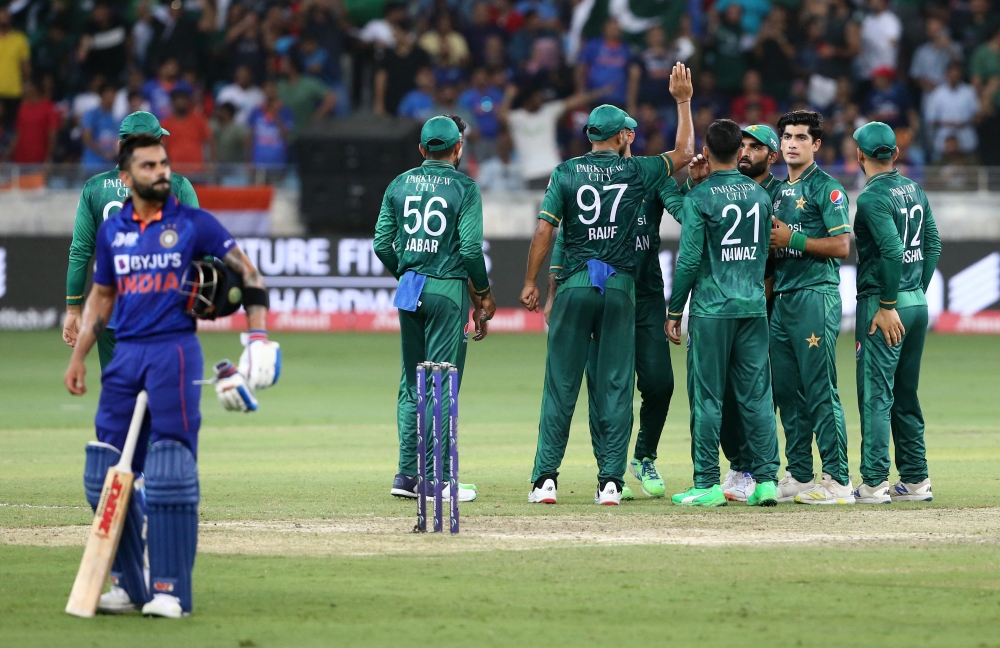 Pakistan's Mohammad Nawaz celebrates with teammates after taking the wicket of India's Suryakumar Yadav during their Asian Cup match at the Dubai International Stadium, Dubai, on September 4, 2022.  REUTERS/Satish Kumar