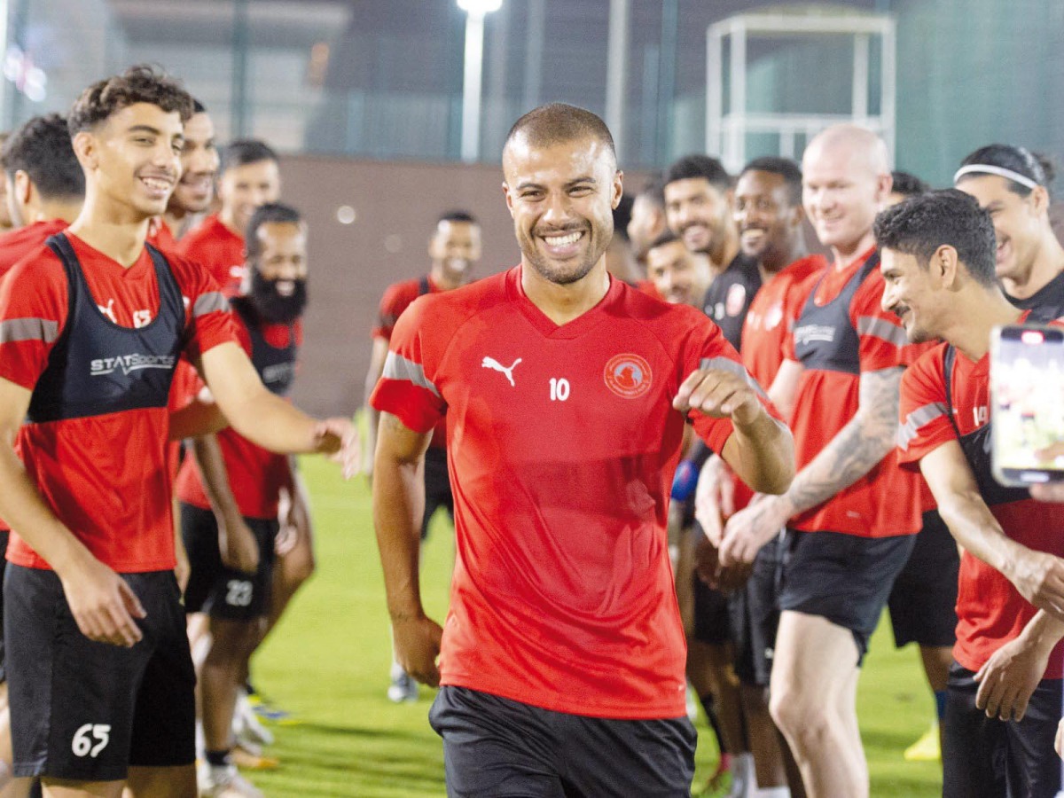 Rafinha Alcantara is welcomed by Al Arabi team-mates prior to his first training session yesterday. 