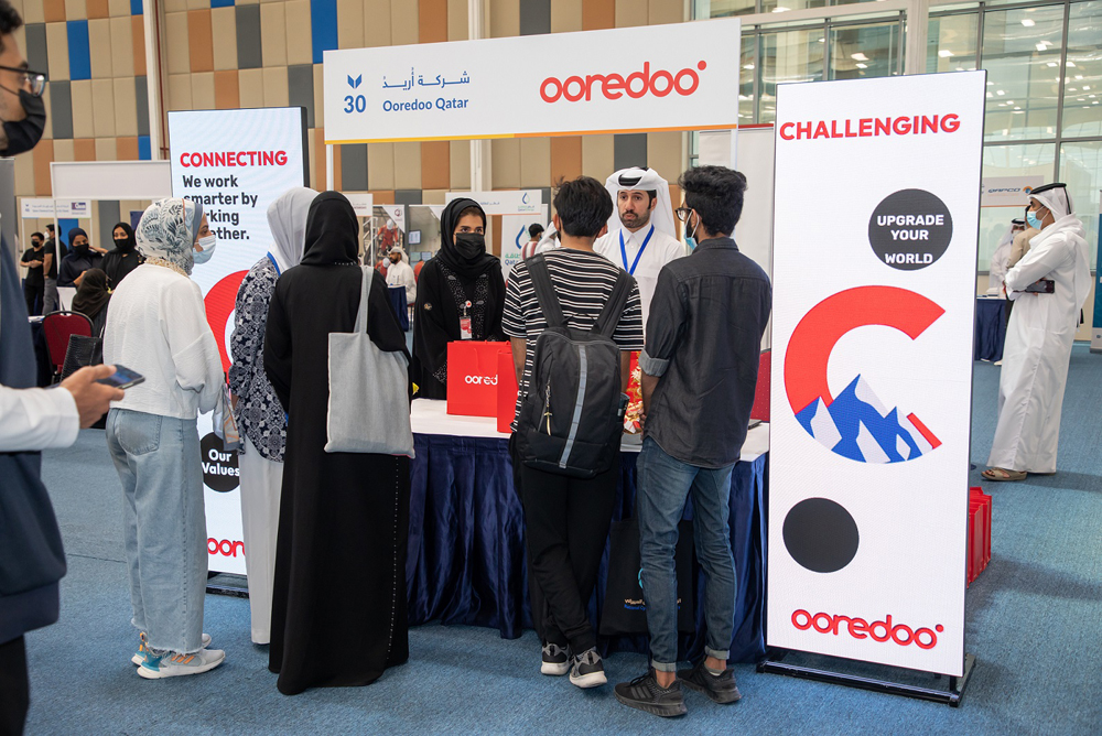 Ooredoo officials interact with students during the Career Fair.