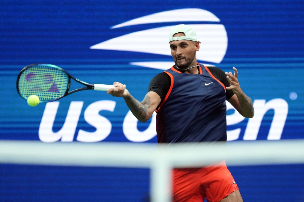 Nick Kyrgios of Australia hits a return during his match against Daniil Medvedev on day seven of the 2022 US Open at the USTA Billie Jean King Tennis Center in Flushing, New York, on September 4, 2022. Mandatory Credit: Danielle Parhizkaran-USA TODAY Sports