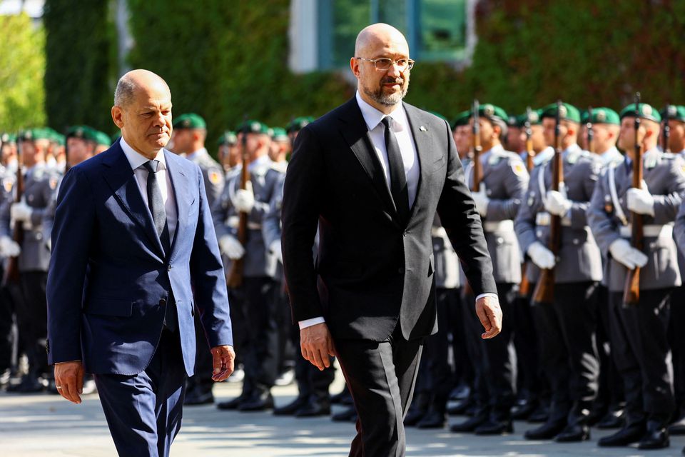 German Chancellor Olaf Scholz welcomes Ukrainian Prime Minister Denys Shmyhal during a military honour ceremony in the courtyard of the Chancellery, in Berlin, Germany, September 4, 2022. REUTERS/Christian Mang


