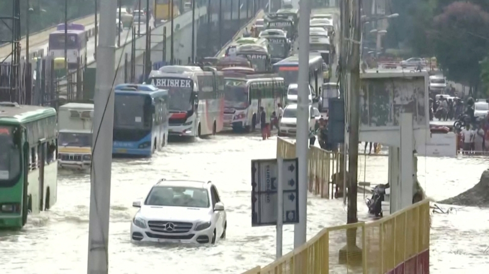 People commute along water-logged roads following torrential rains in Bengaluru, India September 6, 2022. ANI/Reuters TV via REUTERS