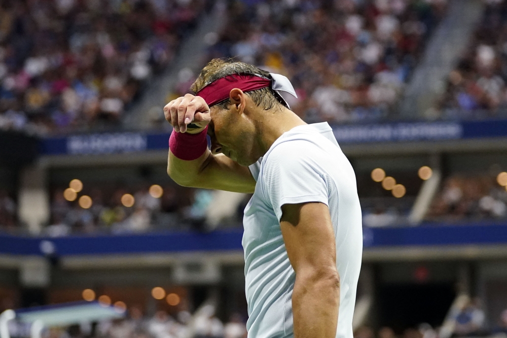 Rafael Nadal of Spain wipes sweat from his forehead during a match against Frances Tiafoe of the United States on day eight of the 2022 US Open tennis tournament at USTA Billie Jean King Tennis Center. Danielle Parhizkaran-USA TODAY Sports