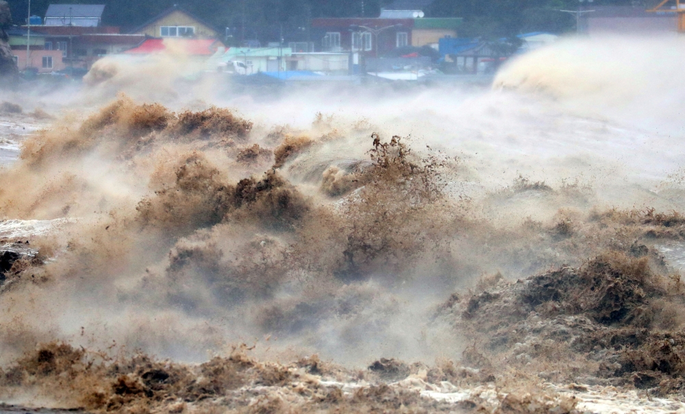 A high wave caused by Typhoon Hinnamnor is pictured in Pohang, South Korea, September 6, 2022. Yonhap via REUTERS