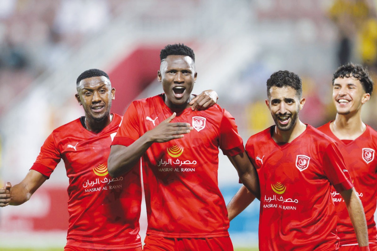 Al Duhail's Michael Olunga celebrates with his team-mates.