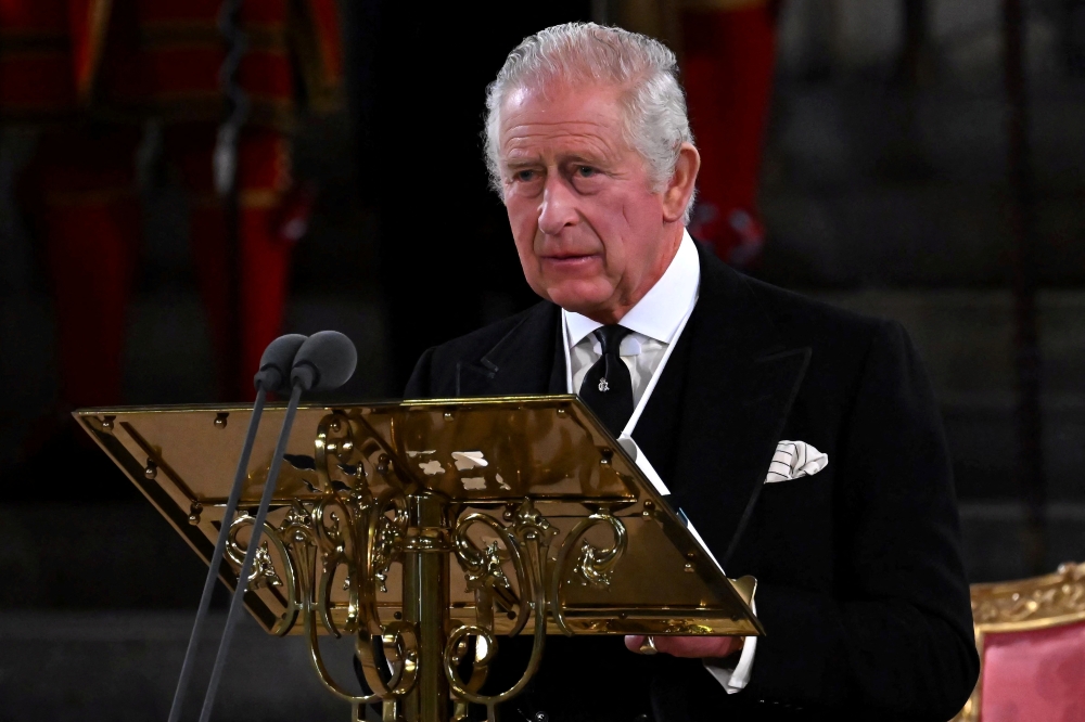 Britain's King Charles speaks during the presentation of addresses by both Houses of Parliament in Westminster Hall, inside the Palace of Westminster, following the death of Britain's Queen Elizabeth, in central London, Britain September 12, 2022. Ben Stansall/Pool via REUTERS