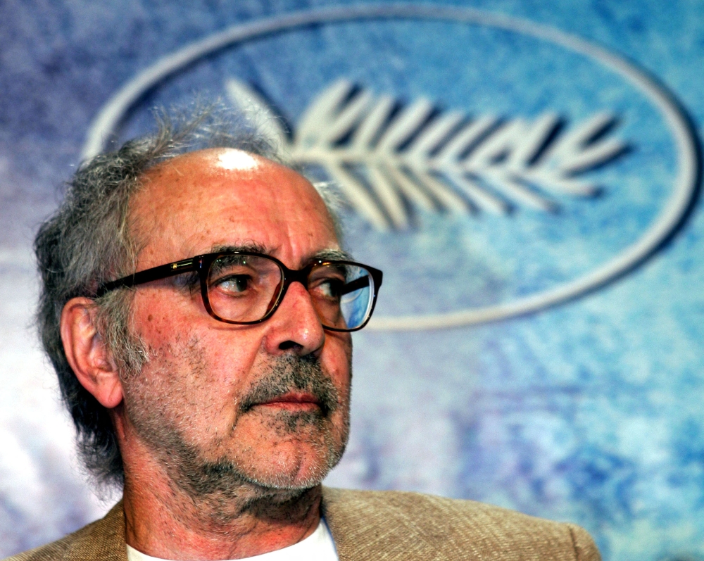 Swiss director Jean-Luc Godard listens to question during a press conference for his film entry 'Notre Musique' which is screened out of competition at the 57th Cannes Film Festival, May 18, 2004. Reuters/Vincent Kessler/File Photo