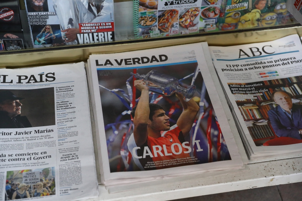 Spain's Carlos Alcaraz is pictured on the front page of a newspaper after winning the US Open final against Norway's Casper Ruud in Murcia, Spain, on September 12, 2022  REUTERS/Violeta Santos Moura