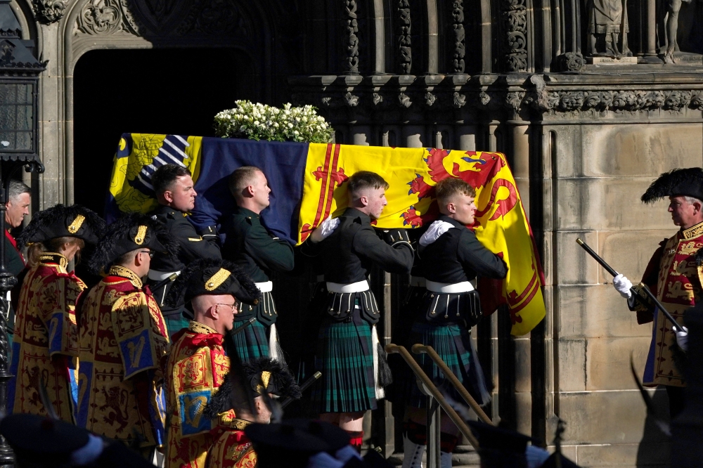 The late Queen Elizabeth II's coffin is carried from St Giles Church in Edinburgh, Scotland, on September 13, 2022. Ian Forsyth/Pool via REUTERS