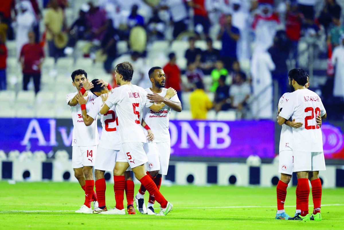 Al Arabi's Abdulaziz Al Ansari celebrates with team-mates. Pic: Mohamed Farag