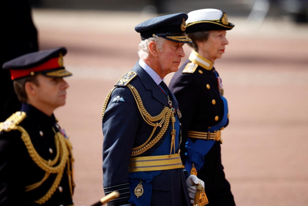 Britain's King Charles marches during a procession where the coffin of Britain's Queen Elizabeth is transported from Buckingham Palace to the Houses of Parliament for her lying in state, in London, Britain, on September 14, 2022. REUTERS/Sarah Meyssonnier