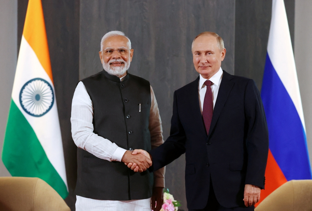 Russian President Vladimir Putin and Indian Prime Minister Narendra Modi on the sidelines of the Shanghai Cooperation Organization summit in Samarkand, Uzbekistan, on September 16, 2022. (Sputnik/Alexander Demyanchuk via REUTERS)