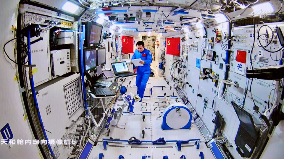 Chinese astronaut Tang Hongbo of the Shenzhou-12 mission works inside the core module Tianhe of the Chinese space station as his colleagues conduct extravehicular activities outside the space station, in this image released by China Manned Space Engineering Office on August 20, 2021.  File Photo/Reuters
