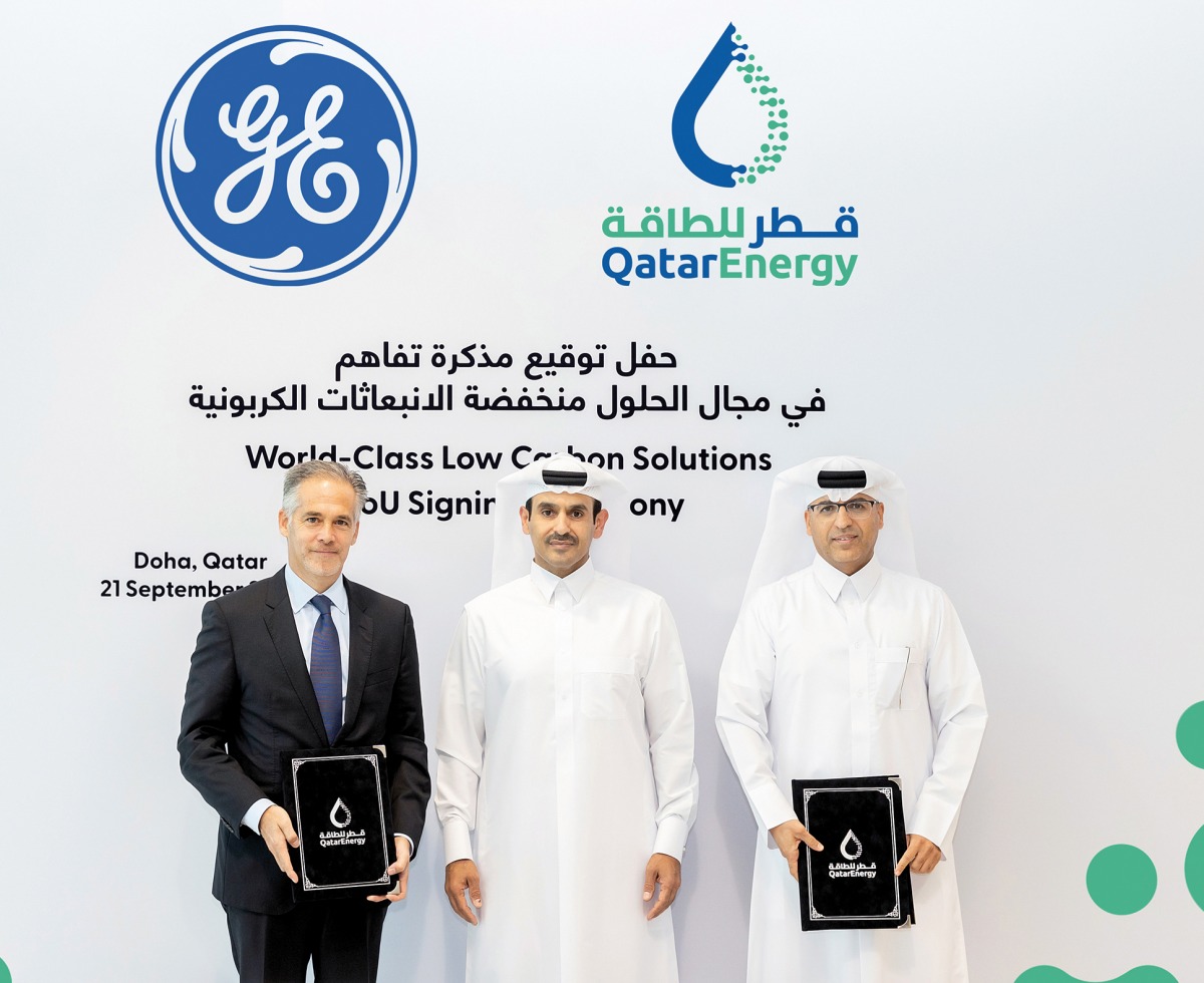 Minister of State for Energy Affairs, the President and CEO of QatarEnergy H E Saad Sherida Al Kaabi, with Ahmad Saeed Al Amoodi, QatarEnergy’s Executive Vice-President, Surface Development & Sustainability and Joseph Anis, President and CEO of GE Gas Power Europe, Middle East, and Africa, during the MoU signing ceremony, in Doha, yesterday. 