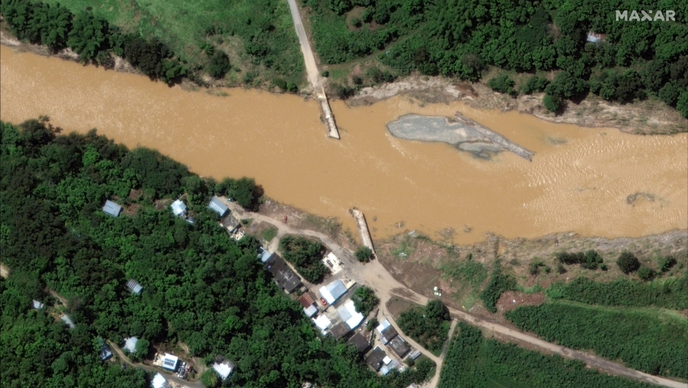 A satellite image shows a flooded bridge in the aftermath of Hurricane Fiona, in Arecibo, Puerto Rico September 21, 2022. Courtesy of 2022 Maxar Technologies/Handout via Reuters