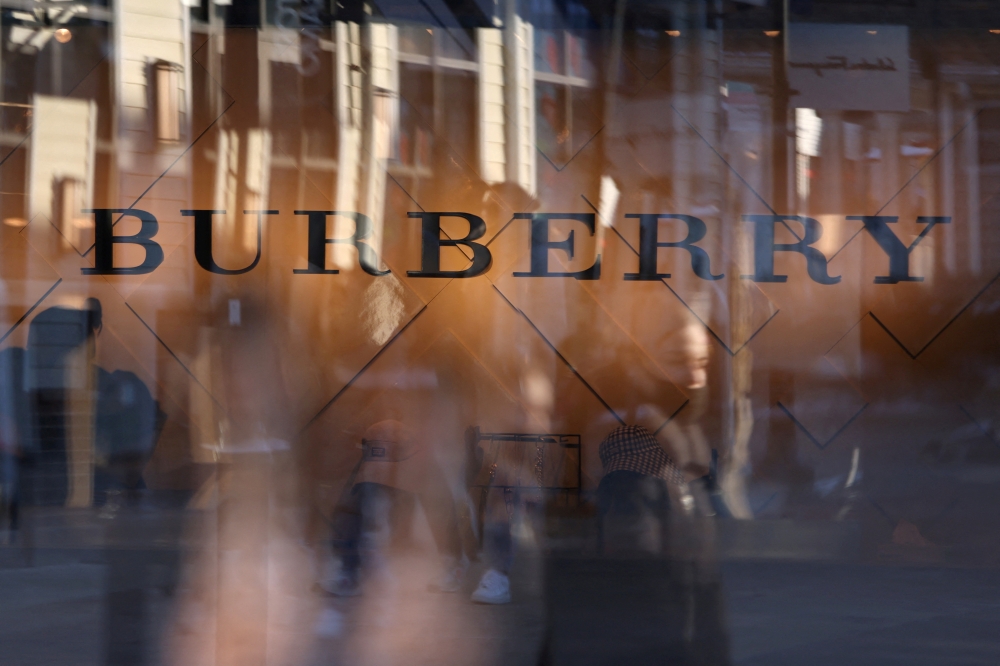 Burberry signage is seen at their store at the Woodbury Common Premium Outlets in Central Valley, New York, U.S., February 15, 2022. REUTERS/Andrew Kelly/File Photo