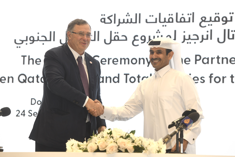 Minister of State for Energy Affairs and President and CEO of QatarEnergy H E Saad Sherida Al Kaabi, and Chairman of the Board and CEO of TotalEnergies Patrick Pouyanné at the agreement signing ceremony yesterday. 